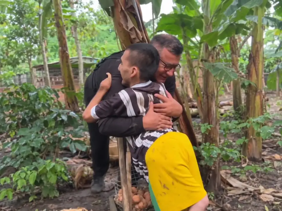 Goyito embracing the man who met him, in a frame from his campaign video